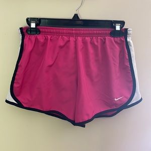 Nike DRI-FIT running shorts. Pink and white. Girls XL or women’s small.